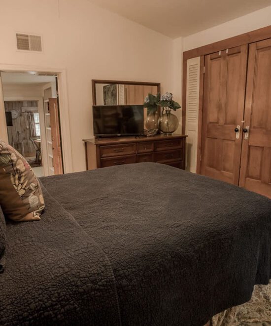 Sundown Cottage Vacation Rental Primary Bedroom Bed & TV