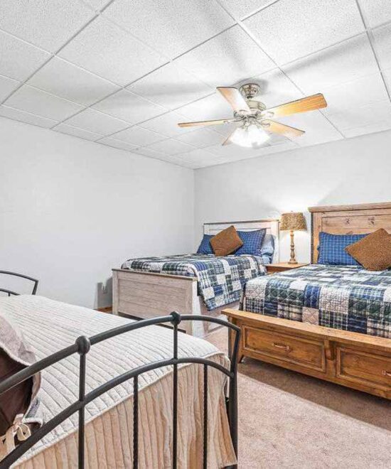 View Point Cabin Vacation Rental Lower Level Bedroom with Queen, Full & 2 Twin Beds